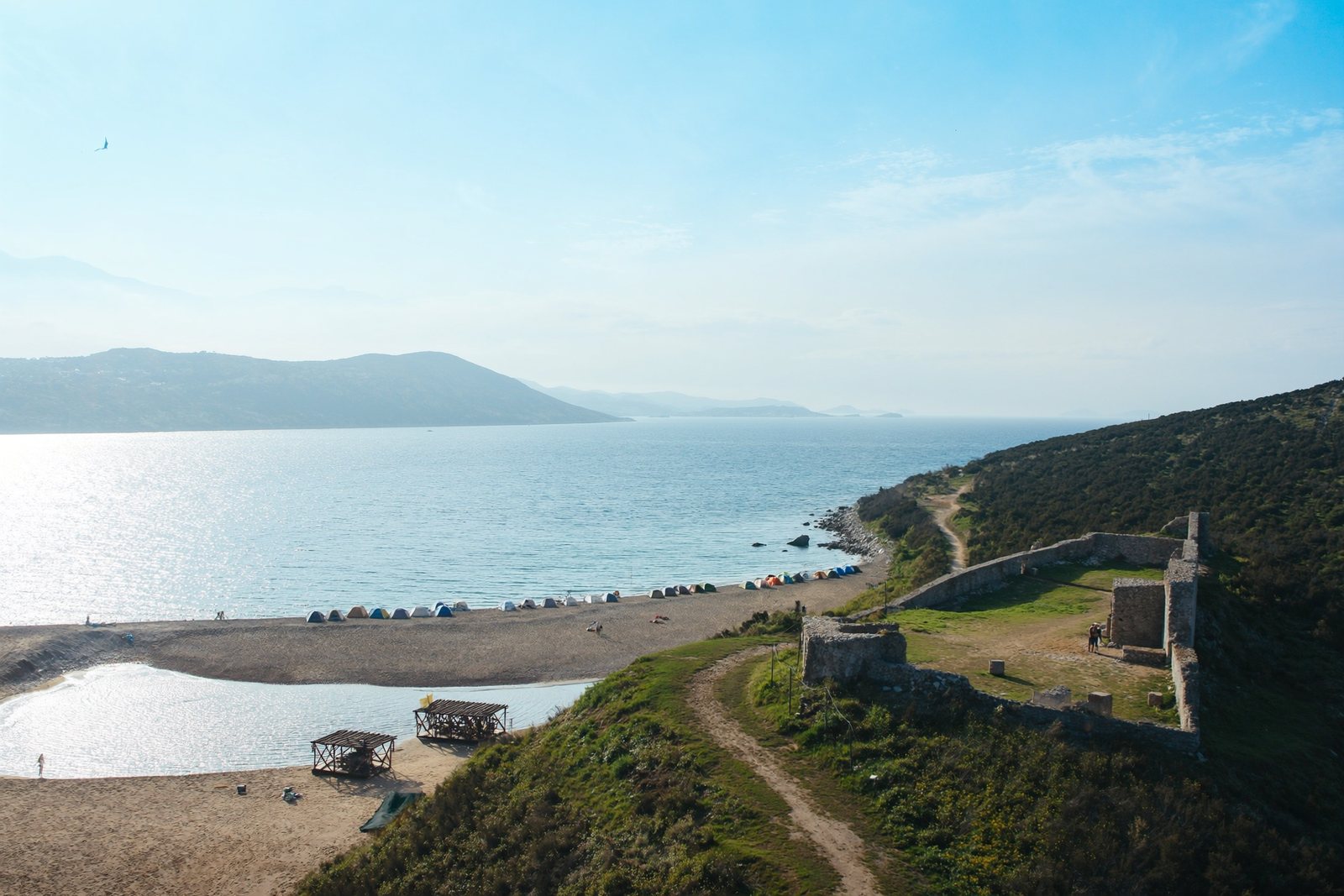General Beach: a sheltered arc below the castle on the Rodon cape