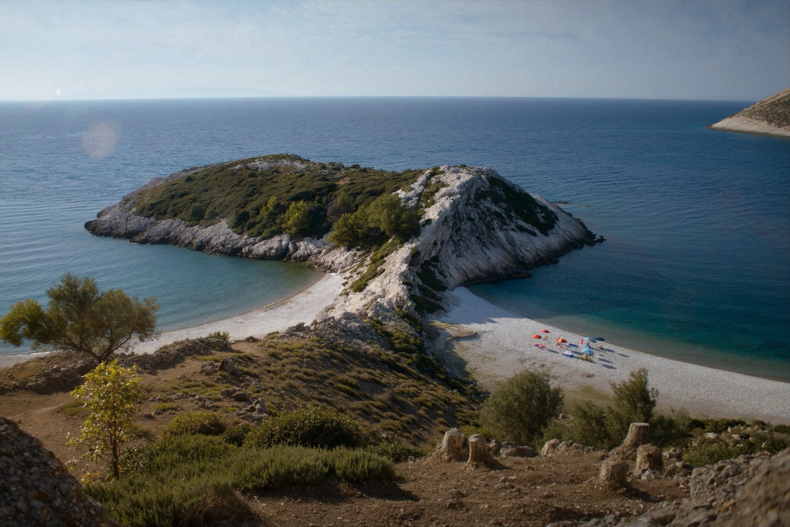 Jal Beach: pebble coves between rocky green hills