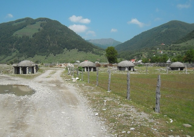 Single-man bunkers along a valley road