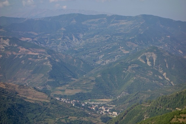 hilly landscape with the city of en:Çorovodë and the Osum valley seen from village Radesh