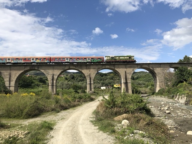 A train crossing a bridge in Central Albania
