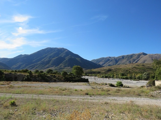 The Kardhiqit River, Albania, near Kardhiq, Gjirokastër County. A pipeline can be seen spanning the river.