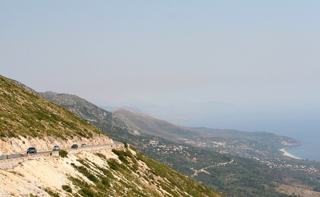 Road on the mountains of the National Park of Llogara looking down on the village of Dhërmi, Himara , Albania