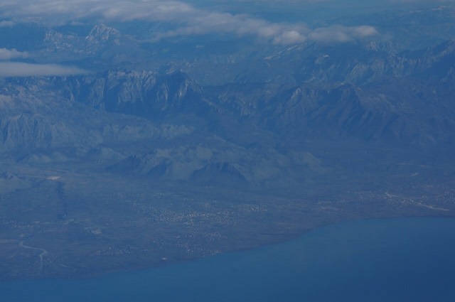 Malësia e Madhe, western part of Albanian Alps, from the air, Lake Skutari and city of Koplik in the front