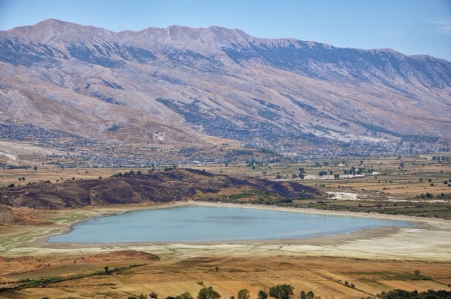 The Libohova Reservoir near Libohovë in Albania, the Dropull Plain and Gjerë Mountain with the city of Gjirokastra and Lazarat village in the background