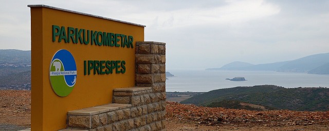 Sign at the entrance to the Prespa National Park in Albania high above Lake Prespa