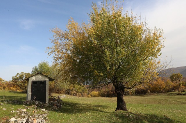 A front view of an electric cabin turned into a small chapel in Pustec, Albania