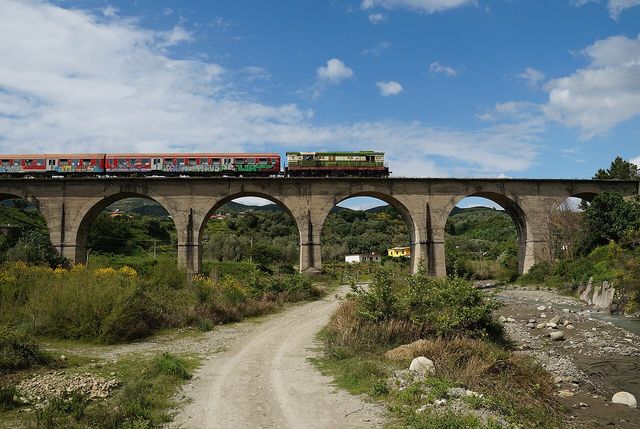 A train on the railway viaduct at Bishqem, near Rrogozhinë